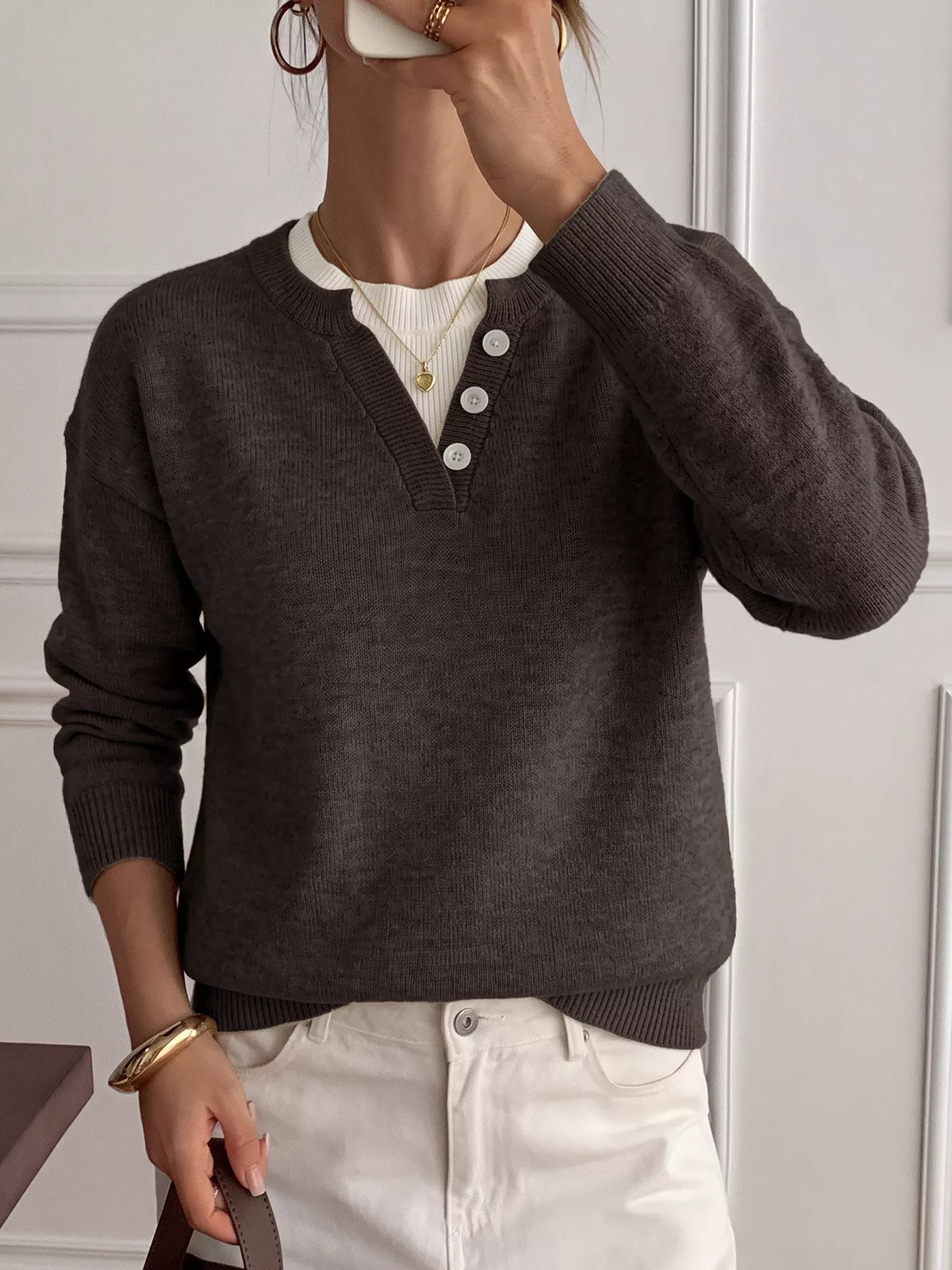 Ribbed knit sweater with decor button placket in a neutral color, featuring a cozy fit and textured fabric from Trendsi.