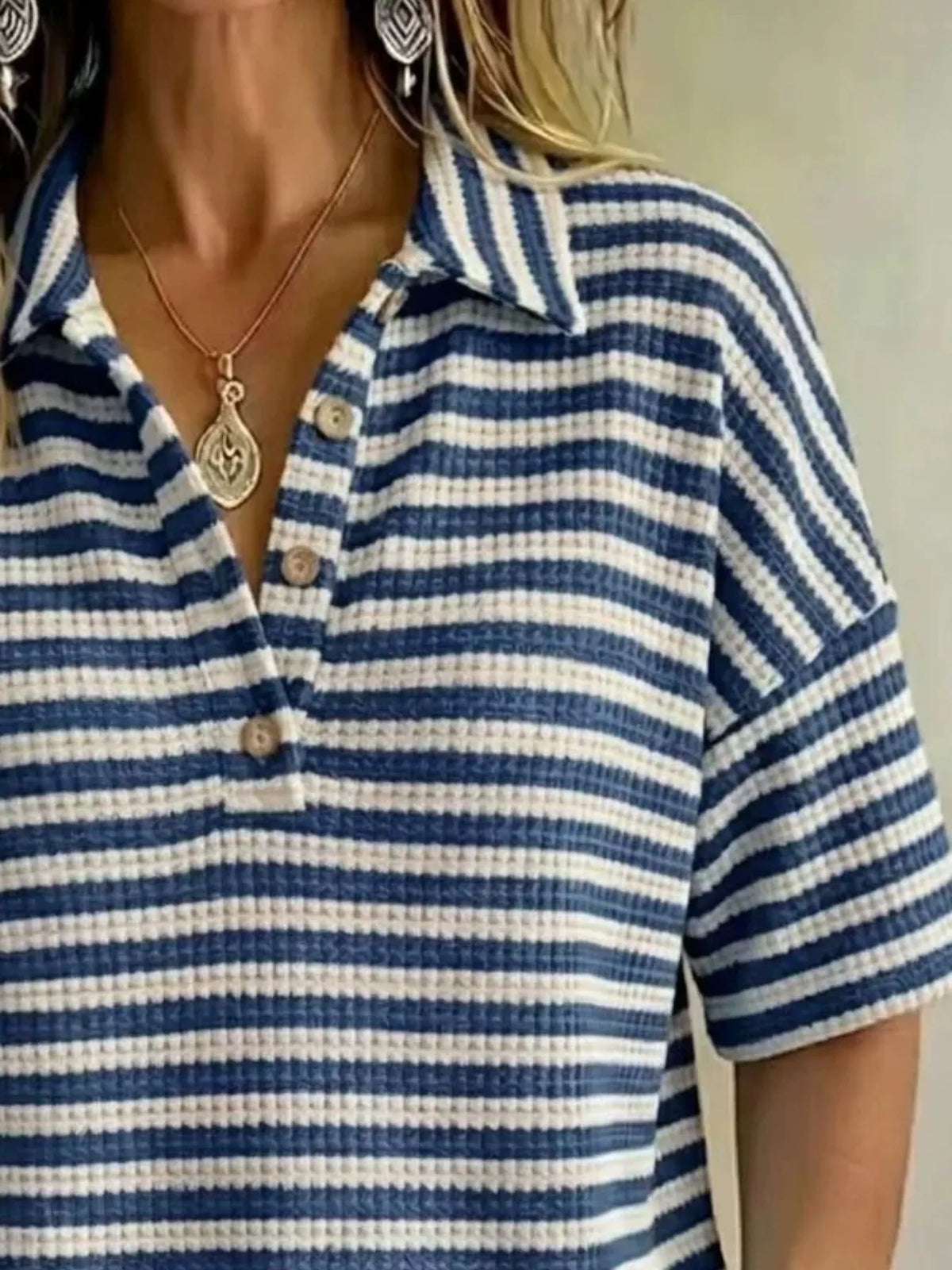 Plus size contrast striped knit polo shirt from Trendsi, featuring a classic collar and short sleeves, shown on a model.