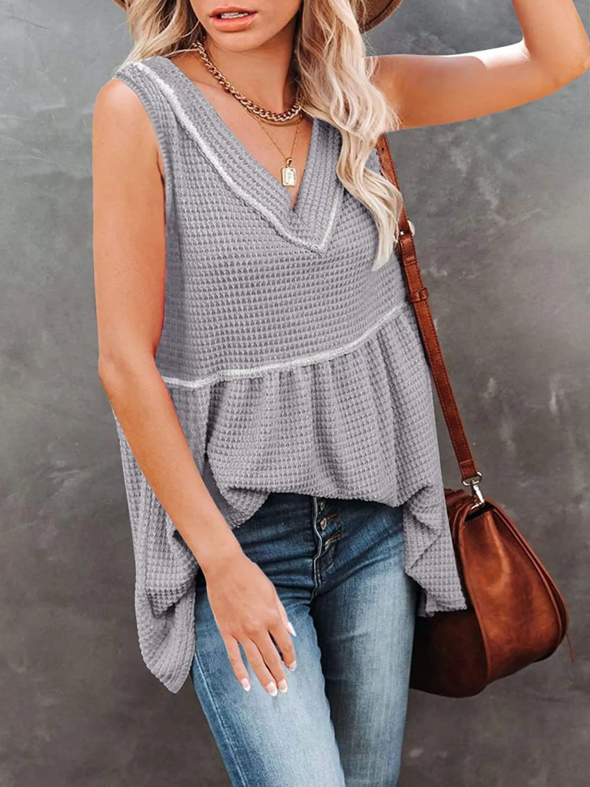 V-neck waffle knit tank top with contrast stitching from Plush Fashion Hub, featuring a close-up of the textured fabric and neckline.
