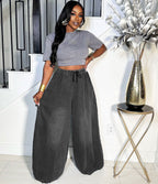 Charcoal grey relaxed-fit, wide-leg denim jeans with an elasticized drawstring waistband.
