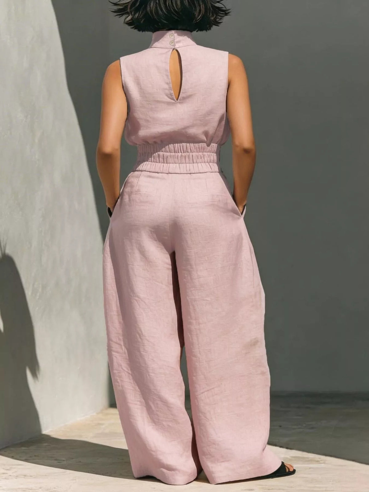 Plush Fashion Hub sleeveless turtleneck top and wide-leg pants set in soft plush fabric, shown in a stylish fashion ensemble.
