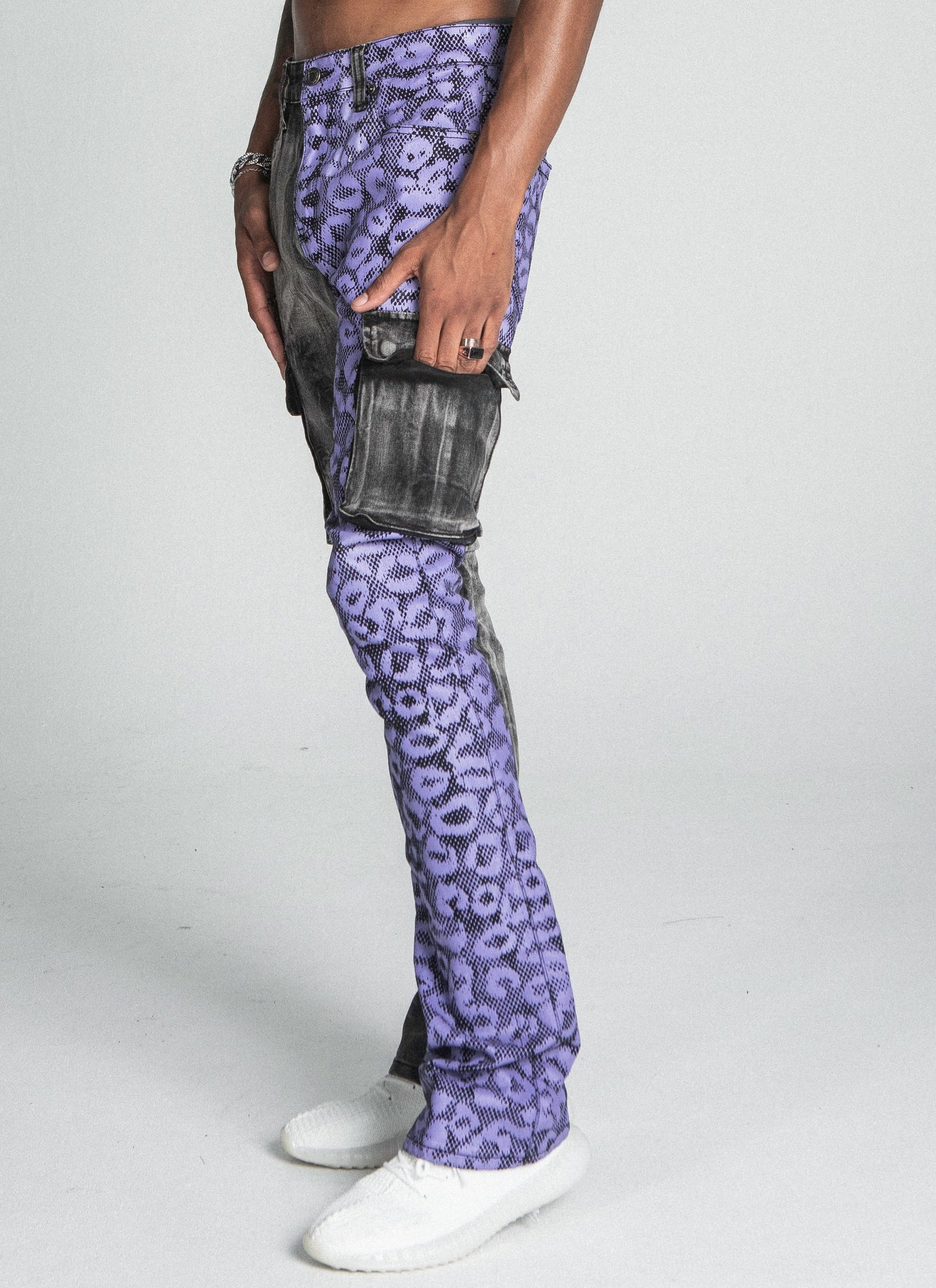Purple cheetah print stacked cargo jeans from Plush Fashion Hub, featuring a relaxed fit and multiple pockets.