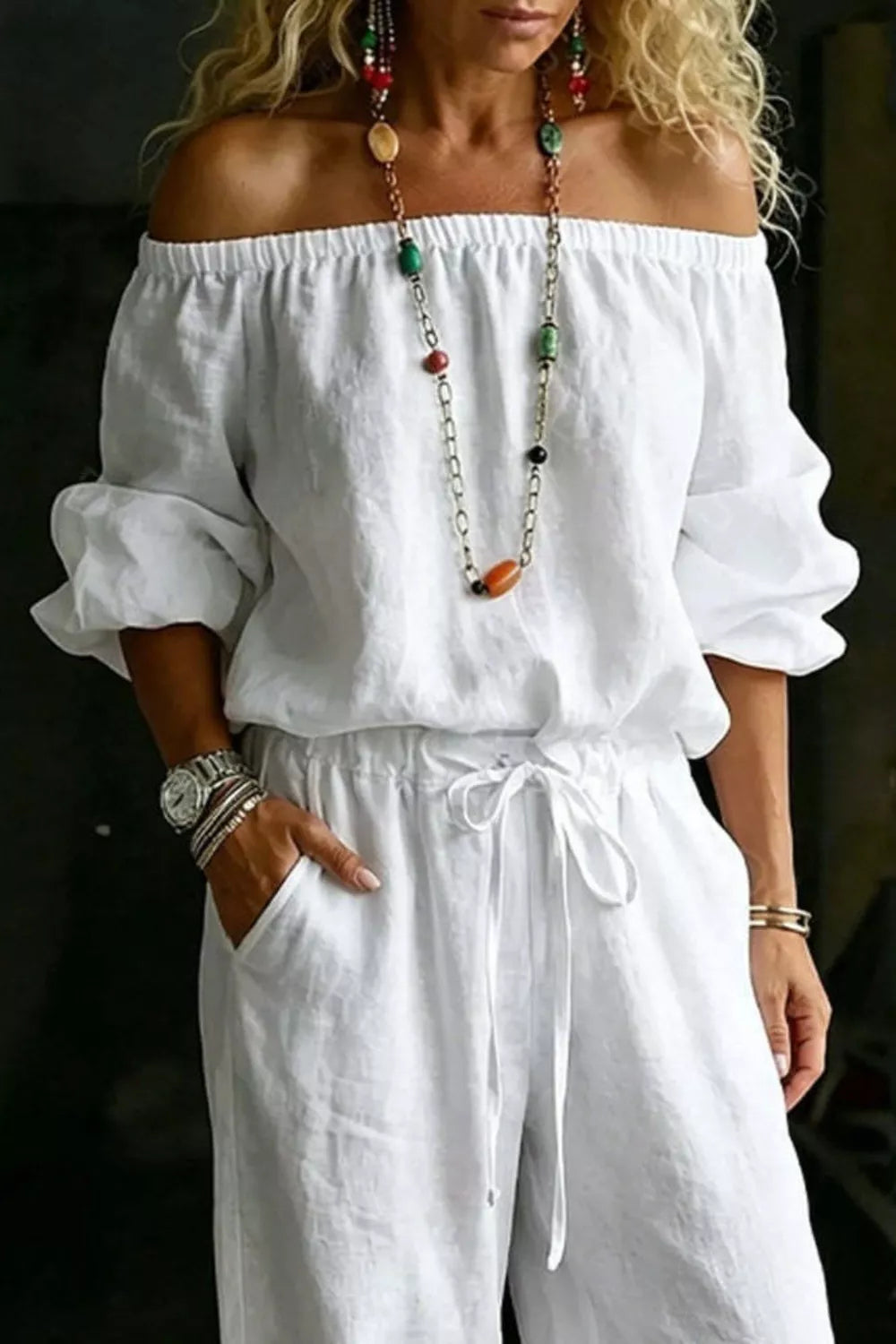 Plus size off-shoulder top and pants set by Trendsi, featuring a matching stylish pants set with a relaxed fit and trendy design.