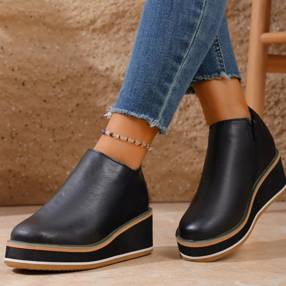 Women's round toe wedge ankle boots by Trendsi, featuring a stylish design with a sturdy wedge heel and ankle-length silhouette.