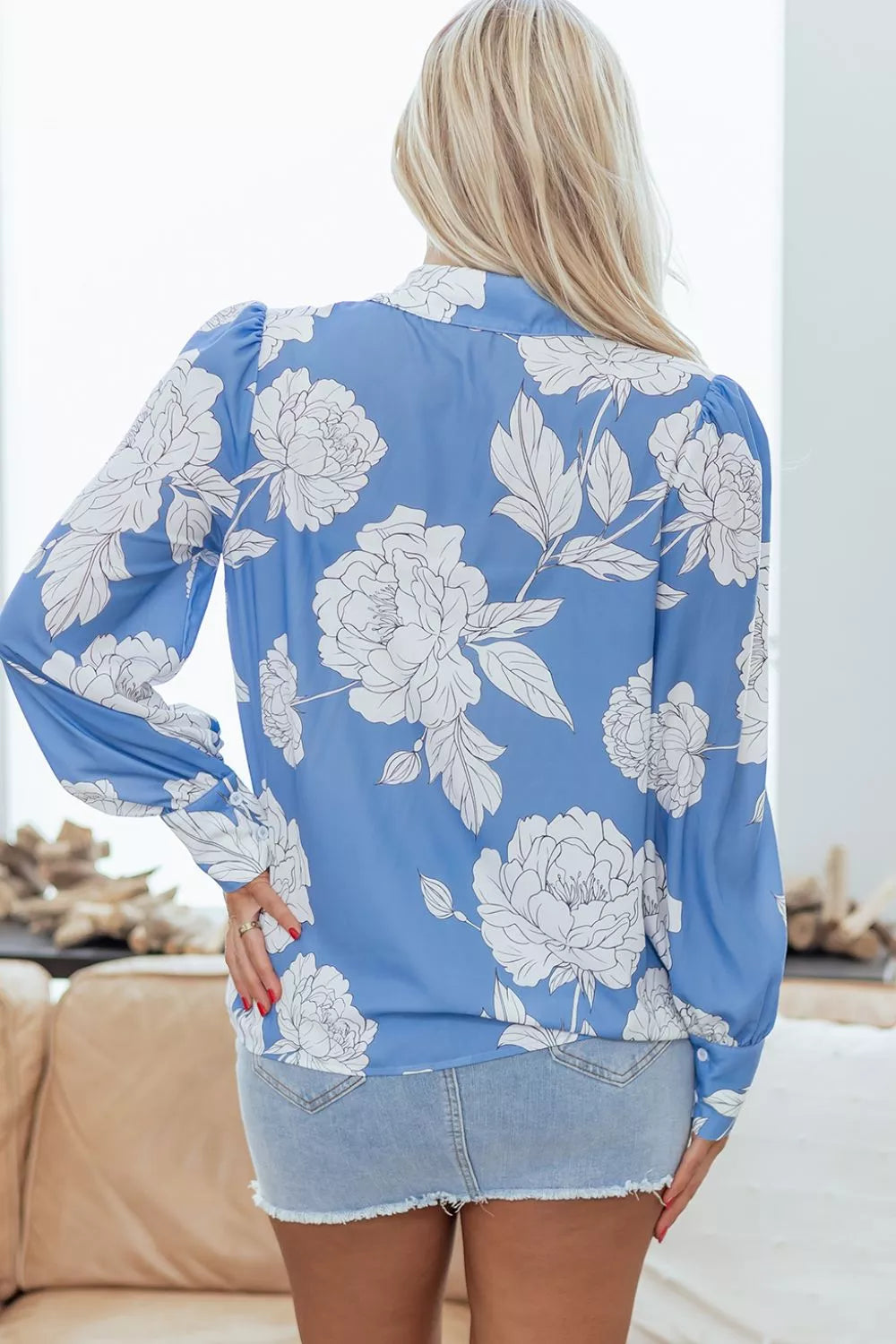 Women's floral print button-up shirt from Trendsi, showing a lightweight, stylish blouse with vibrant floral patterns and a classic collar.