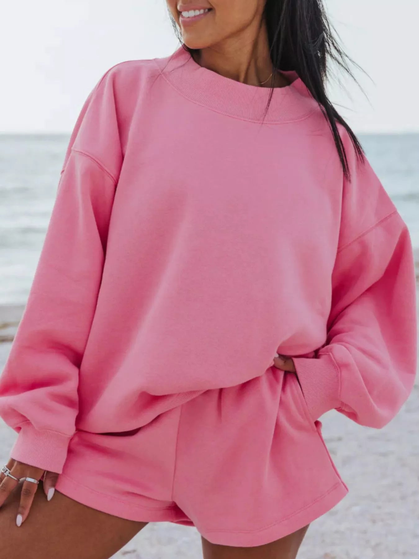 Relaxed fit round neck sweatshirt and shorts set from Trendsi, featuring a comfortable casual 2-piece outfit.