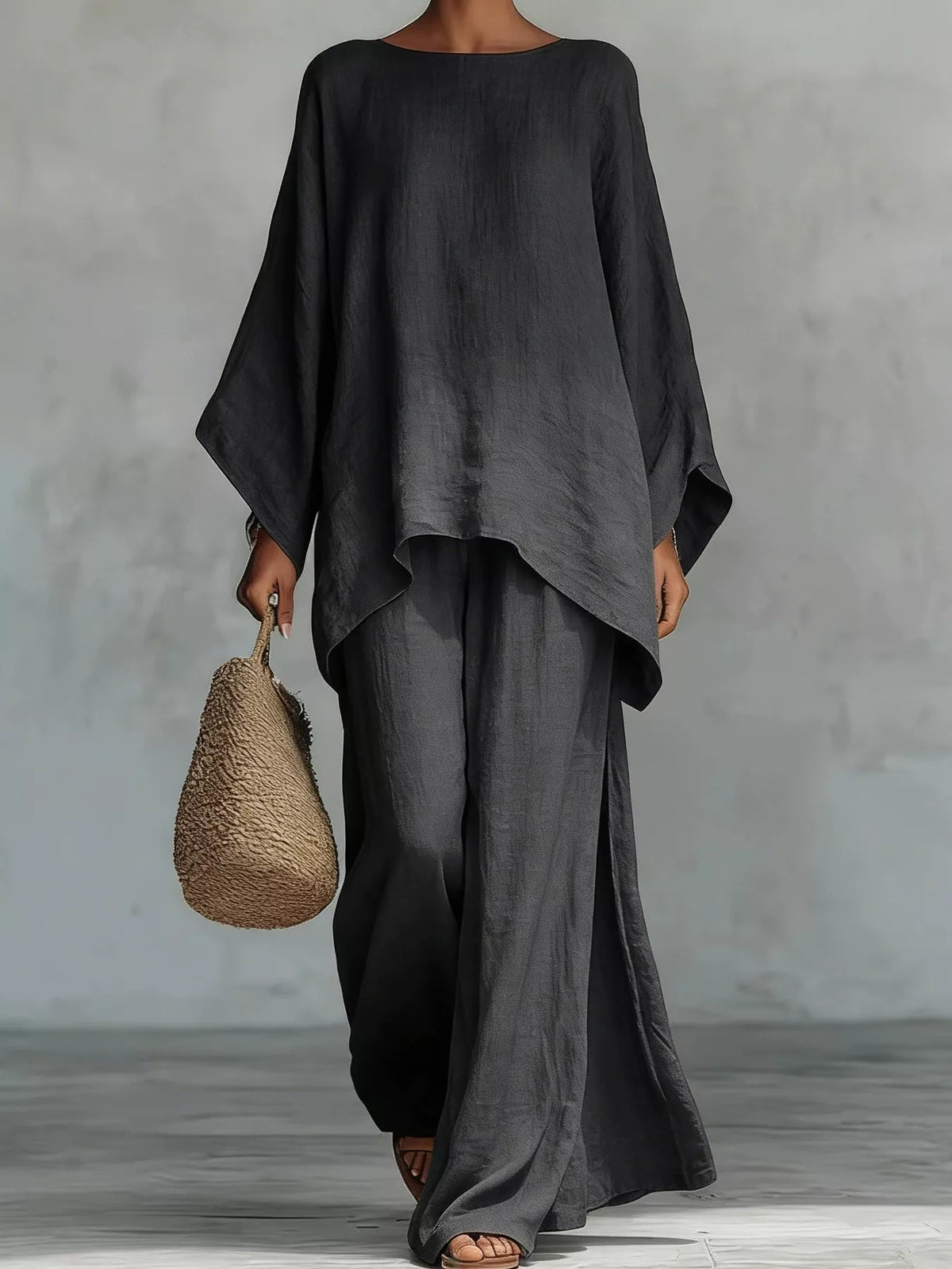 Plus size casual loose fit top and pants set by Trendsi, comfortable two-piece pants set, full size, relaxed style.