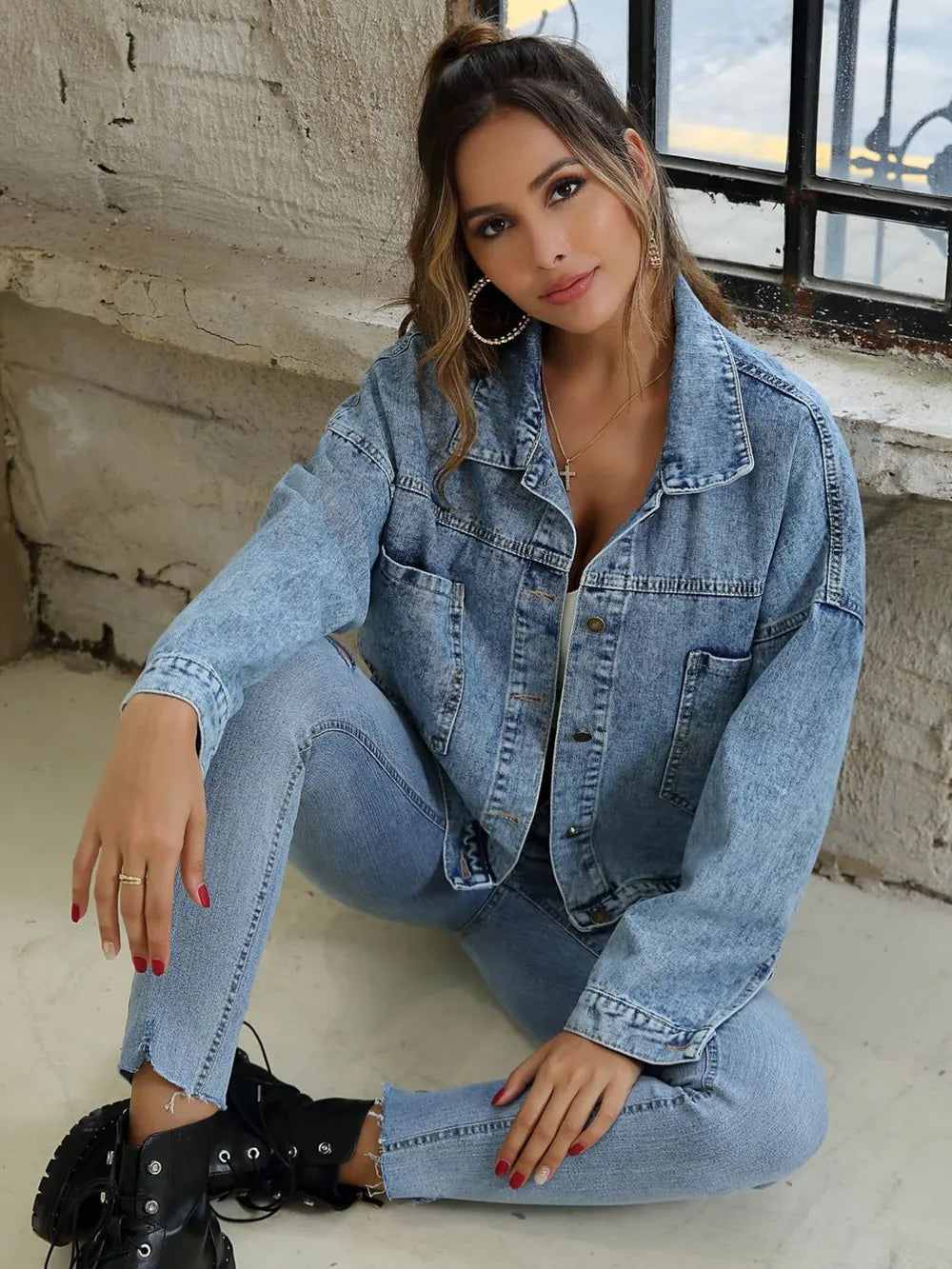 Light blue denim jacket with drop shoulder design and button-down front, styled as trendy trendy denim jeans by Trendsi.
