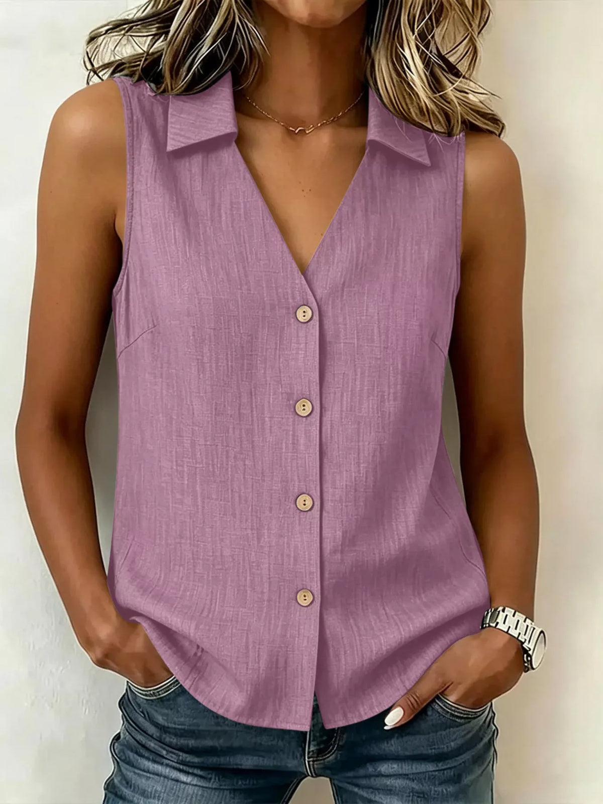 Plus size sleeveless button-up collared top from Trendsi, shown in a full view with front button details and collar.