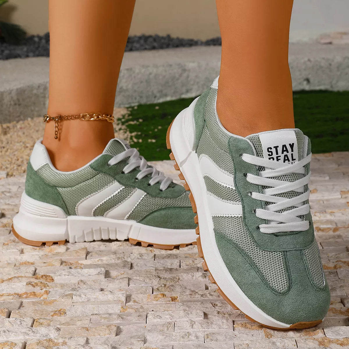 Women's round toe lace-up sneakers by Trendsi, featuring a stylish design and comfortable fit, shown in a close-up view.