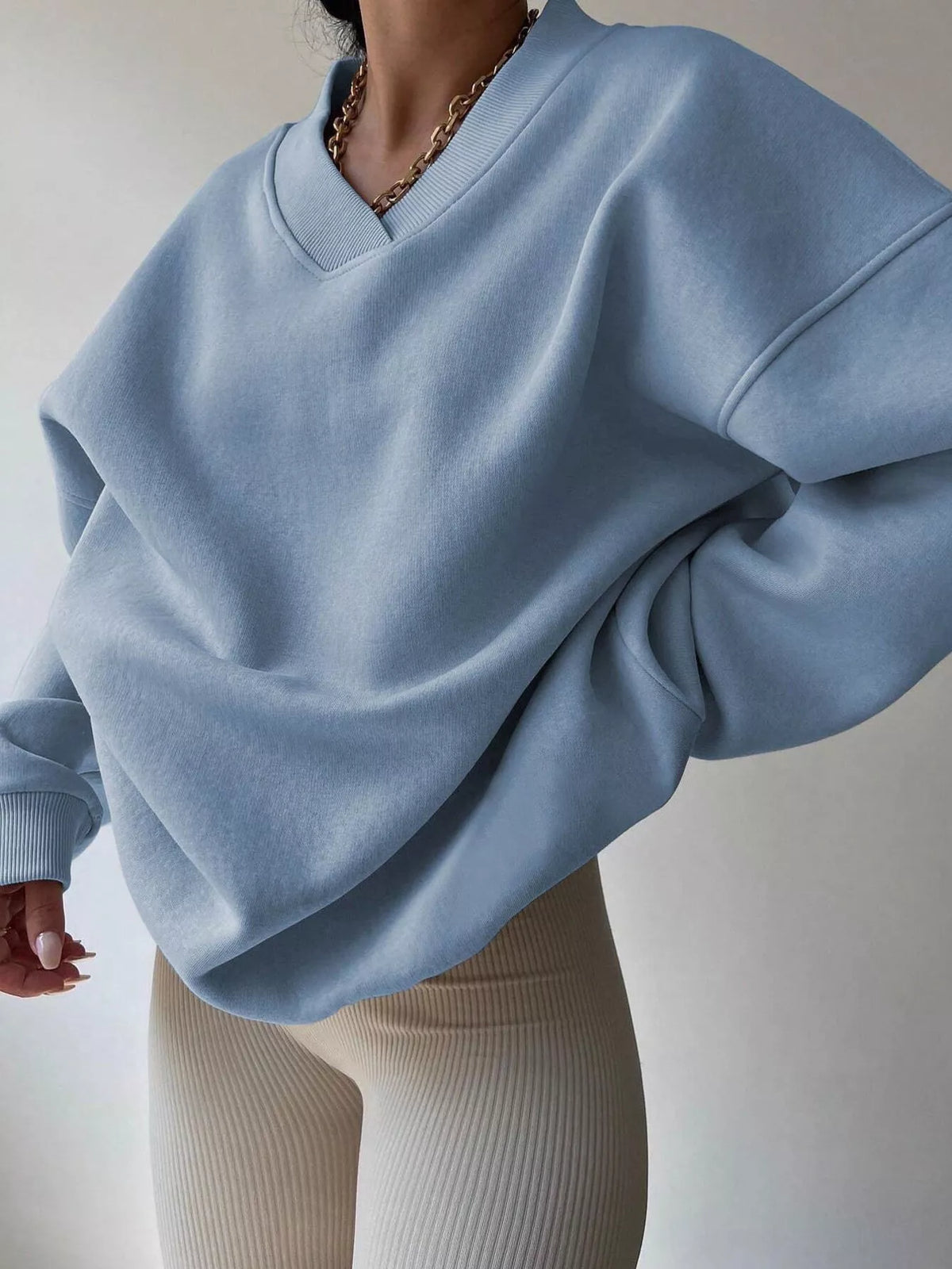 Oversized dropped shoulder long sleeve sweatshirt in soft fabric, featuring a relaxed fit and trendy style from Trendsi.