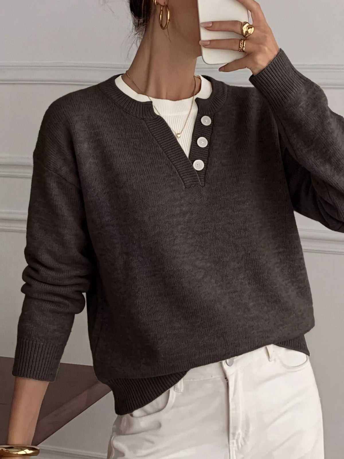 Ribbed knit sweater with button-placket by Trendsi, featuring a cozy, fitted design in neutral tones.