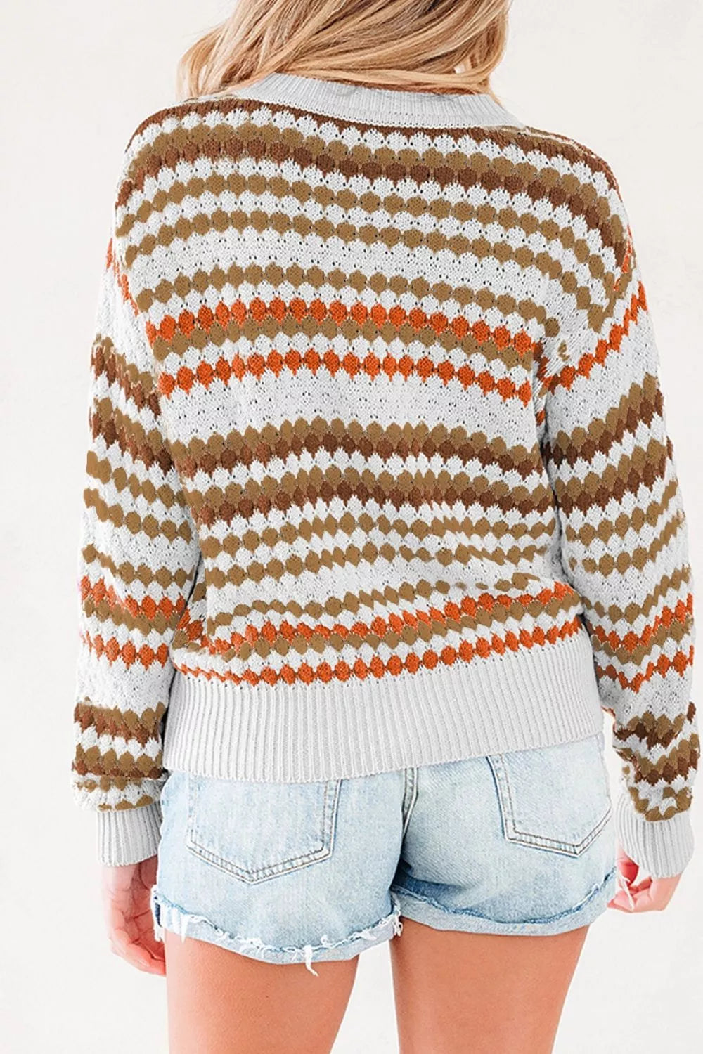 Women's striped geometric pattern sweater by Trendsi, featuring a stylish design with bold stripes and a cozy fit.