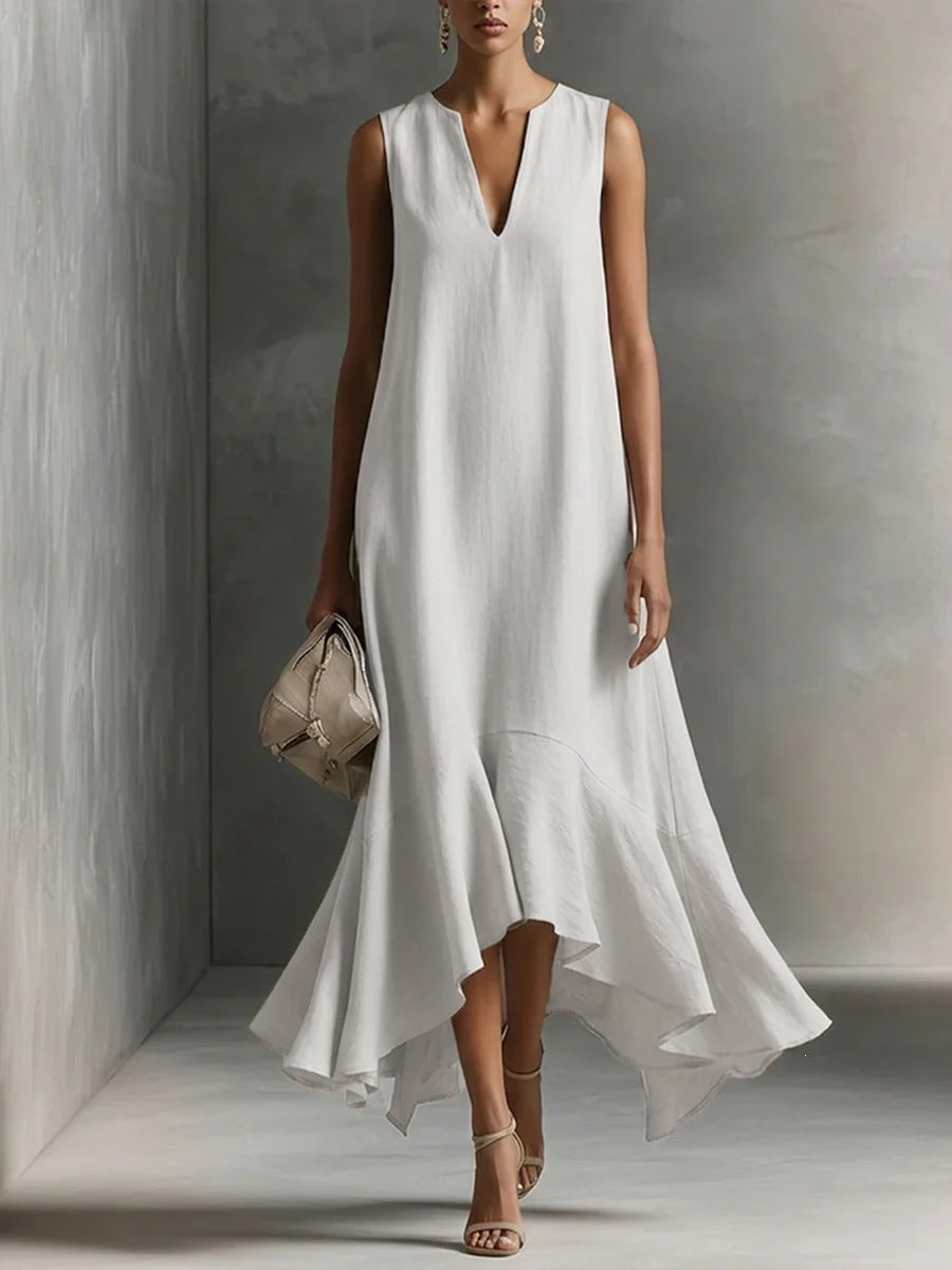 Women's deep V-neck sleeveless asymmetrical patchwork maxi dress by FitiqueFit, featuring a flowing design and unique hemline.