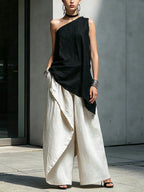 Women's one-shoulder asymmetric sleeveless top from Plush Fashion Hub, featuring a stylish and modern design.