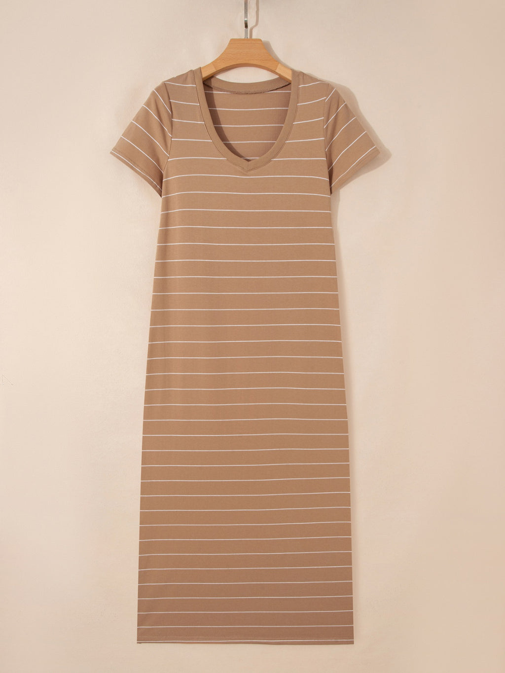 Women's striped short sleeve maxi T-shirt dress with side slit from Trendsi, showing a casual, comfortable fit with bold stripe pattern.