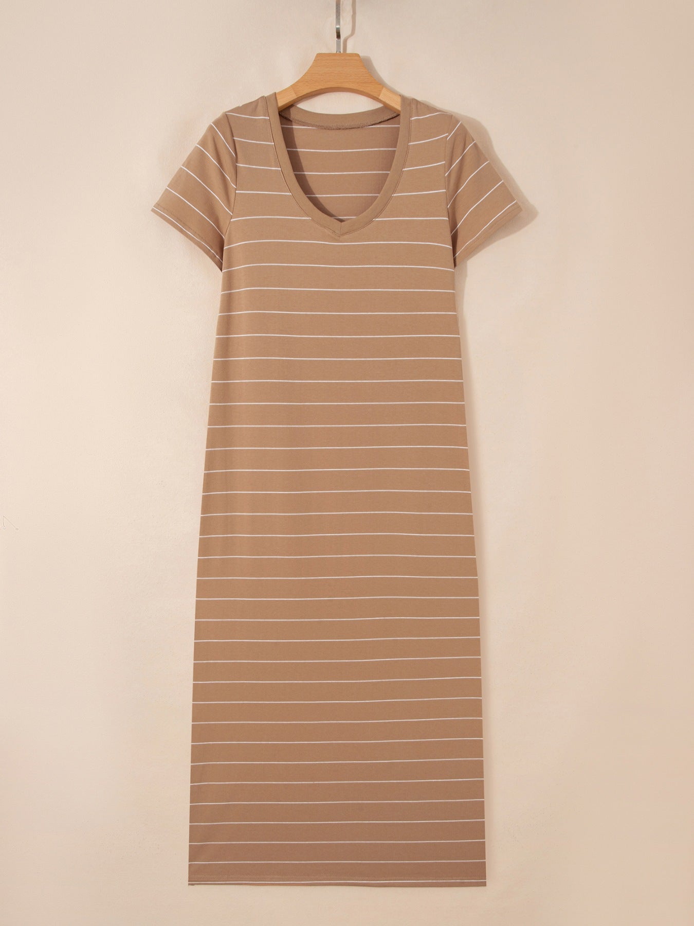 Women's striped short sleeve maxi T-shirt dress with side slit from Trendsi, showing a casual, comfortable fit with bold stripe pattern.