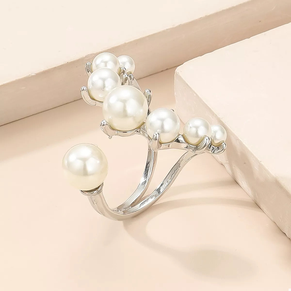 Plush Fashion Hub alloy pearl open ring featuring a sleek band with a prominent pearl accent on a white background.
