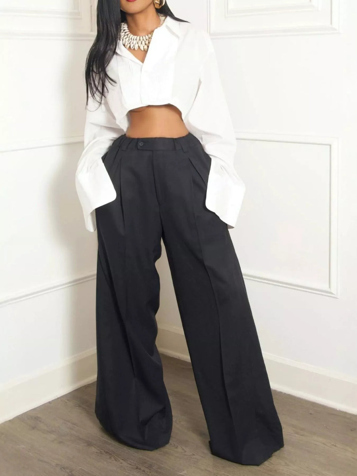Wide leg pleated pants for women by Trendsi, featuring flowy fabric and high waist design, shown in a flattering fit.