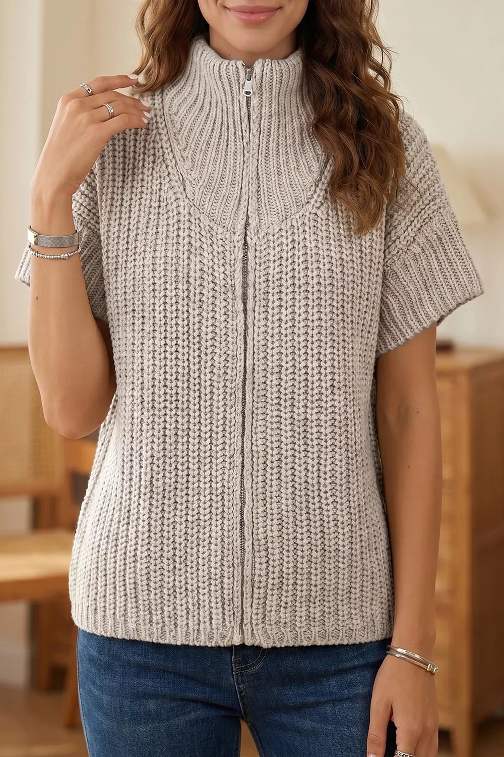 Solid color short sleeve zipper knit high neck sweater by Trendsi, showing a close-up of the sweater's high neckline and zipper detail.