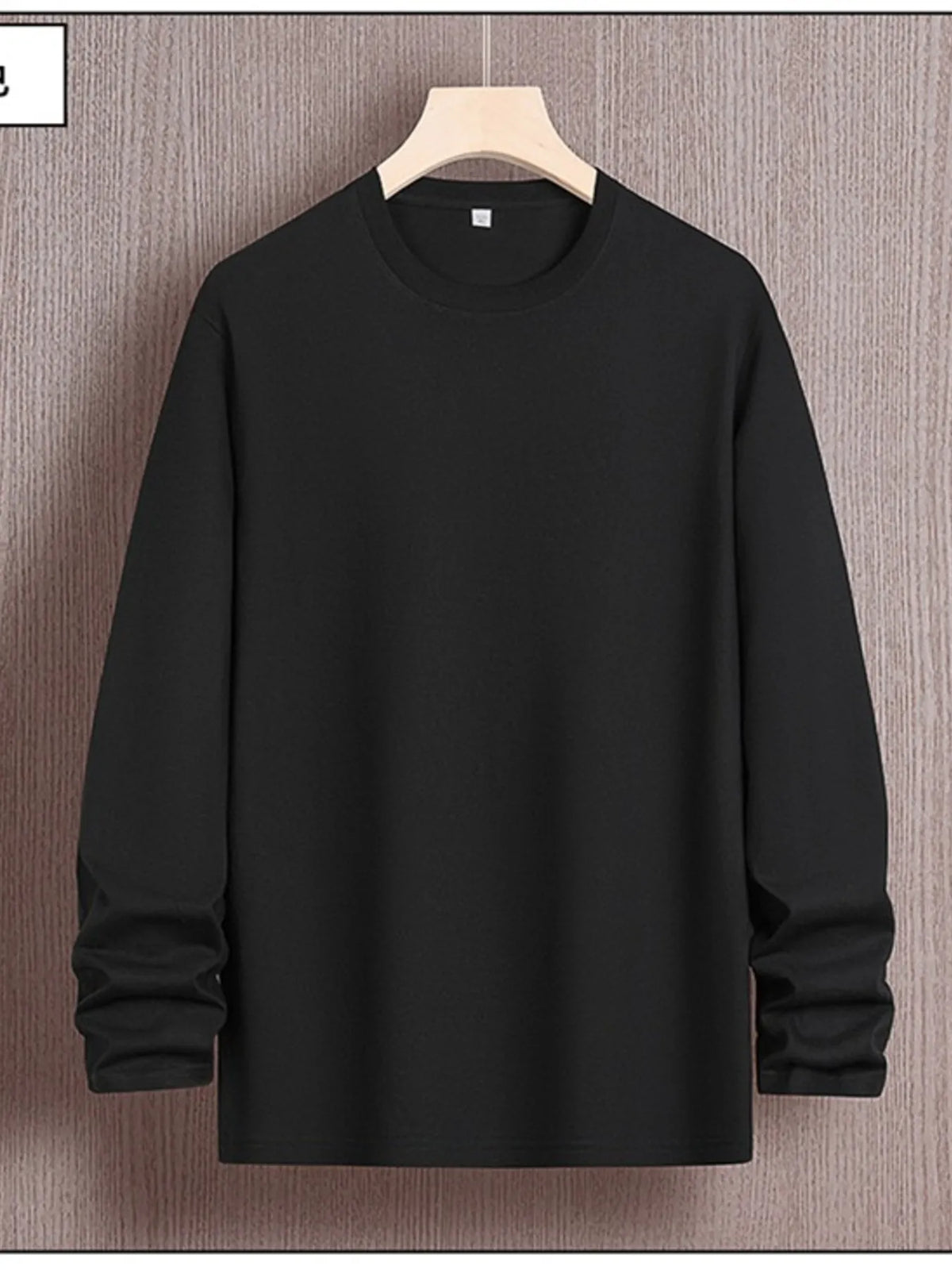 Men's plus size round neck long sleeve T-shirt from Trendsi, showcasing the black fabric and comfortable fit.