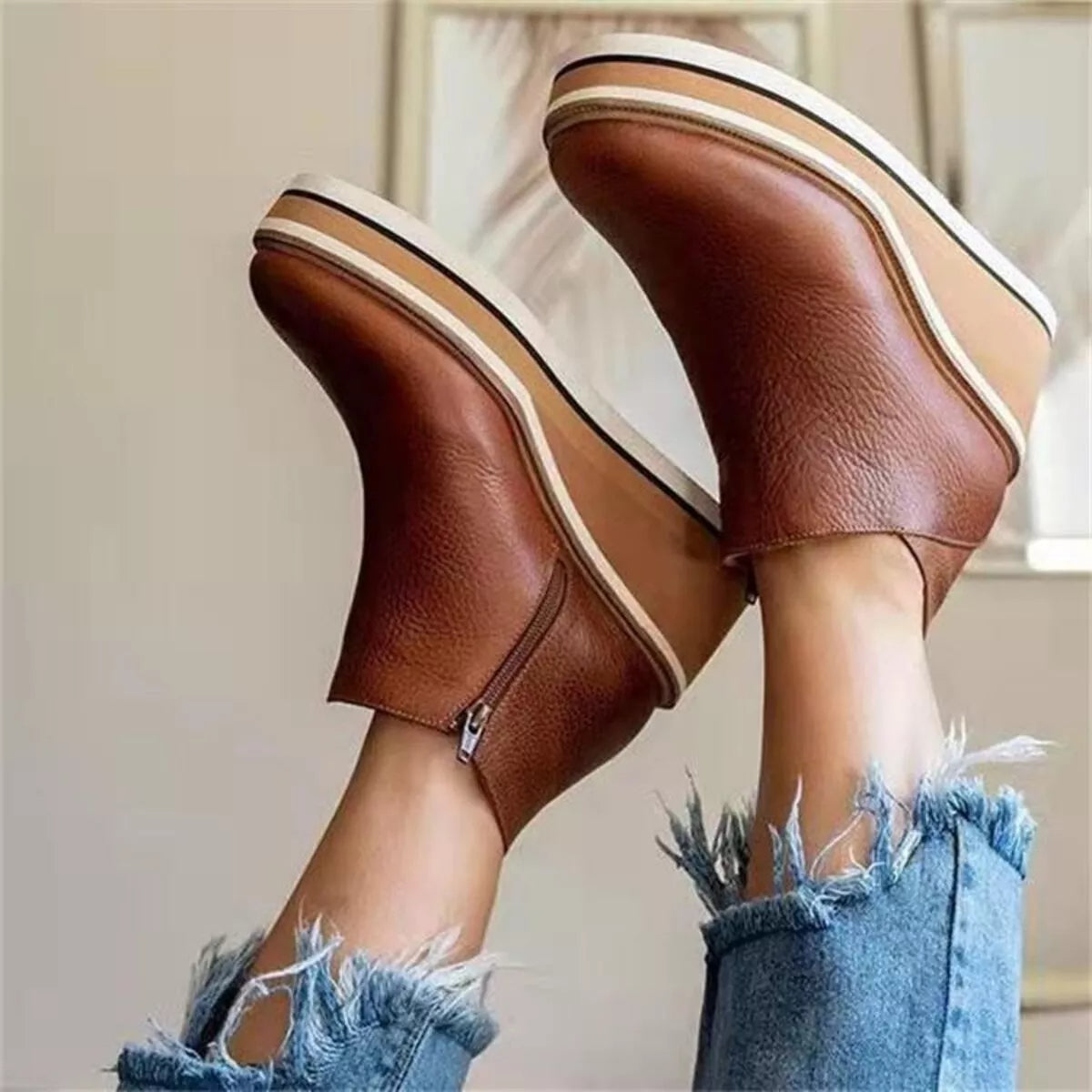 Women's ankle wedge boots with zipper from Trendsi, featuring a stylish design and comfortable wedge heel.