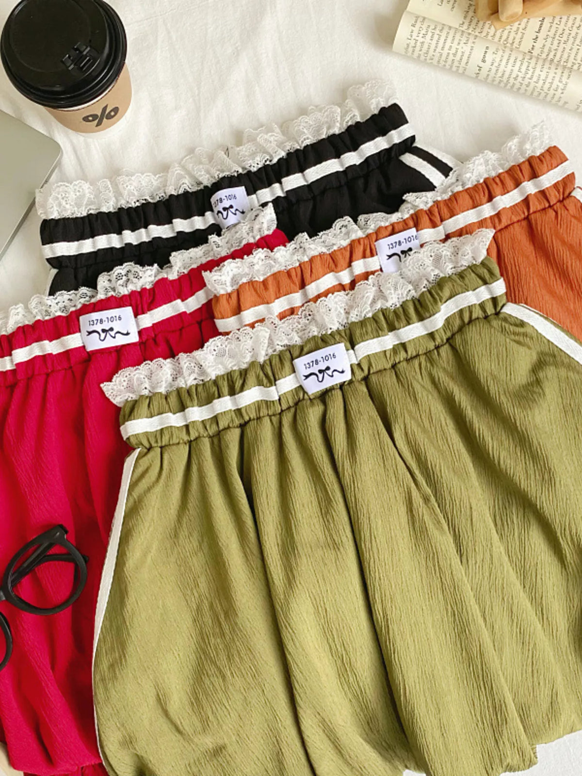 Plush Fashion Hub lace trim elastic waist mini skirt with floral lace details and fitted silhouette on model.