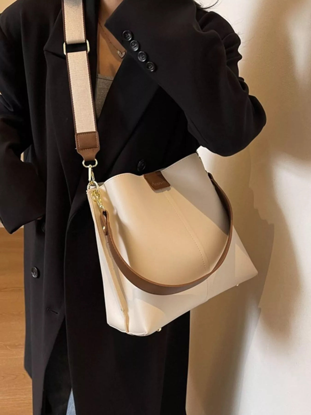 Plush Fashion Hub PU leather crossbody handbag with adjustable strap and sleek design, suitable for casual or formal wear.