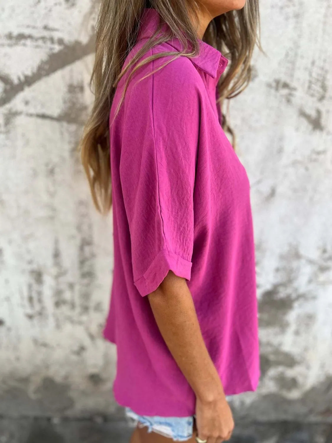 Women's collared button-down office blouse from Plush Fashion Hub, featuring half sleeves and a tailored fit in a professional style.