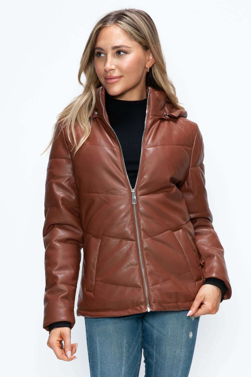 Pocketed zip up puffer jacket with removable hood in brown pleather.