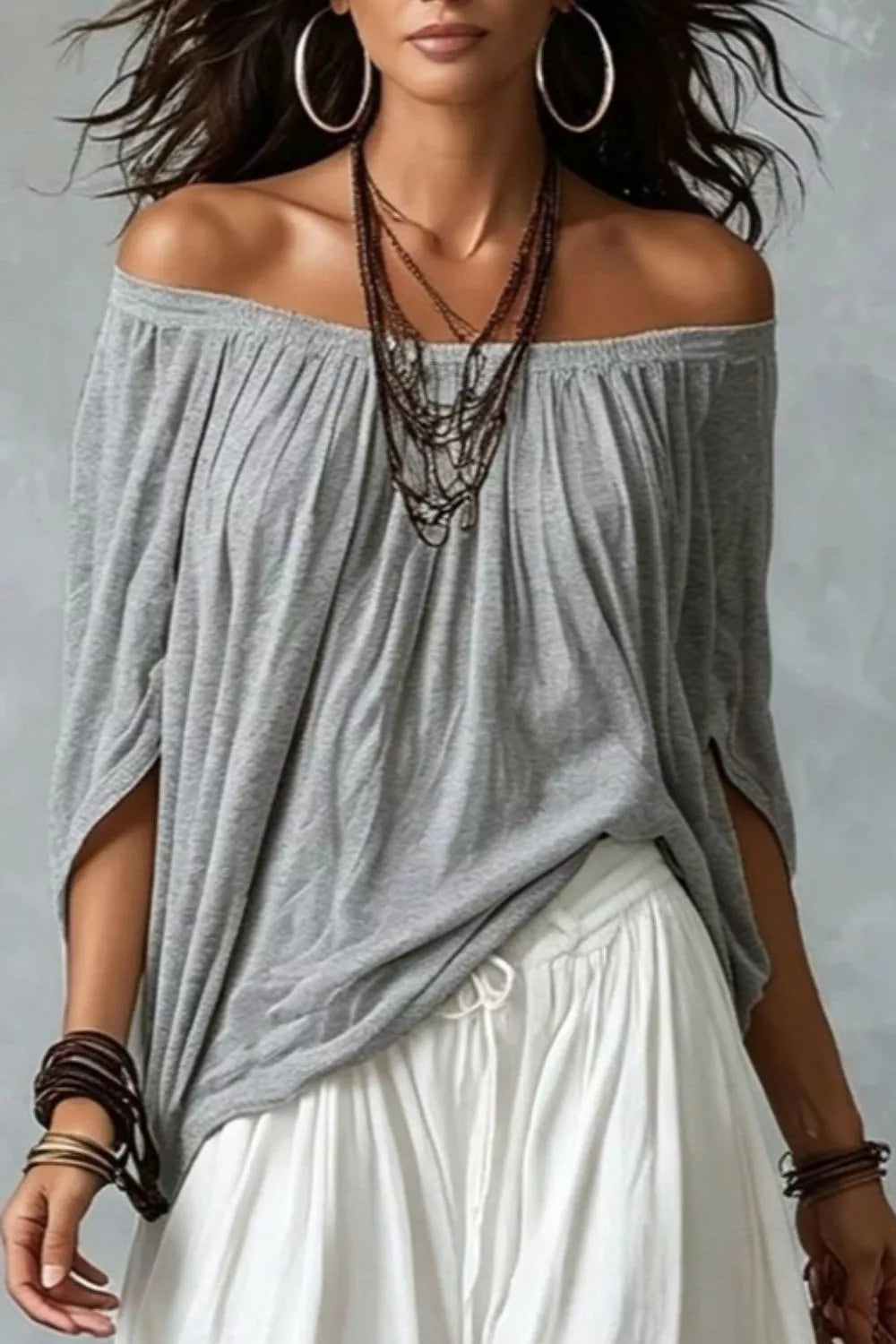 Plus size off-shoulder top and wide-leg pants matching set by Trendsi, featuring a stylish, comfortable ensemble in natural fabric.