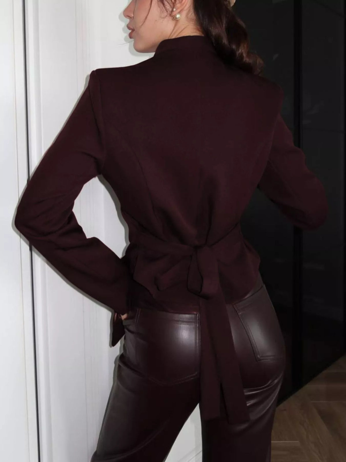 Slim-fit asymmetric hem blazer from Trendsi featuring tailored fit, notched collar, and sleek design for modern style.