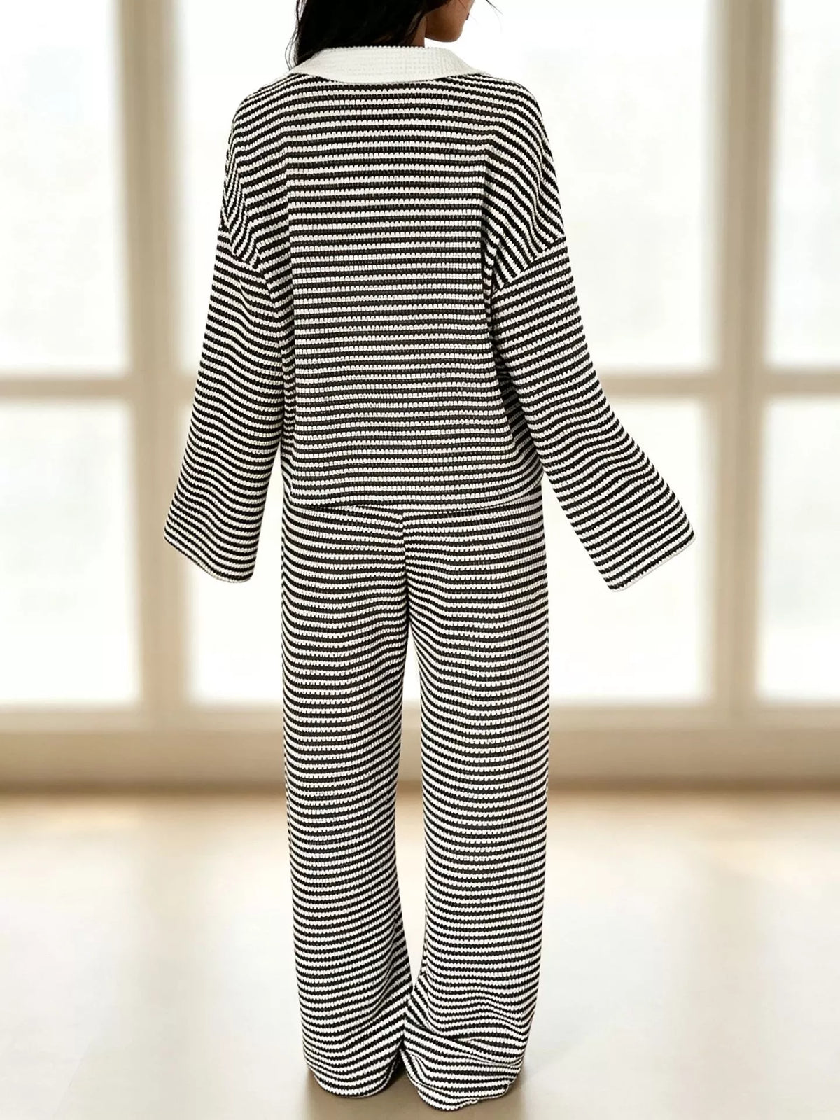 Striped long sleeve polo and wide-leg pants set by Trendsi featuring a casual, stylish matching outfit with bold stripe pattern.