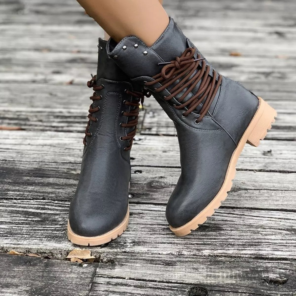 Lace-up black block heel boots from Trendsi featuring a stylish design and sturdy heel for fashionable footwear.
