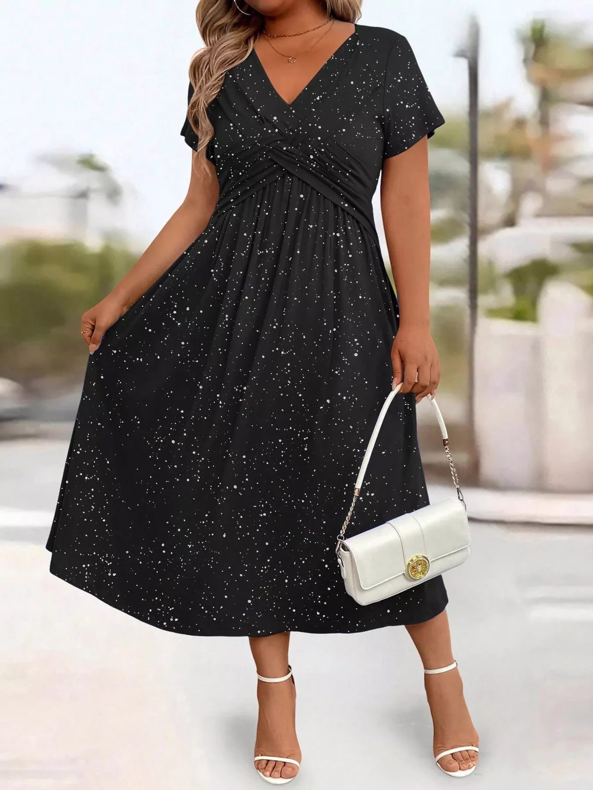 Plus size glitter flutter sleeve midi dress by Trendsi, featuring a shimmering fabric and flowy silhouette for elegant style.