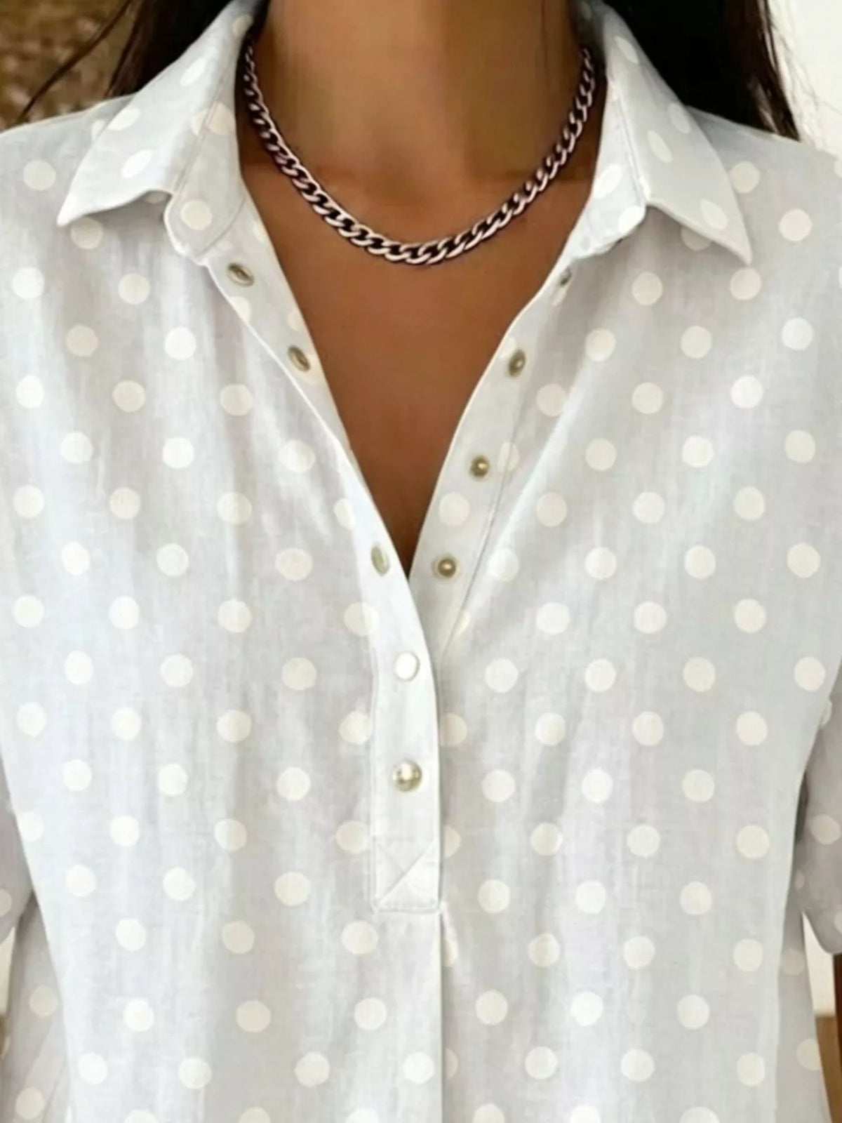 Plus size polka dot short sleeve shirt from Trendsi, lightweight tops with a stylish pattern, perfect for casual wear.