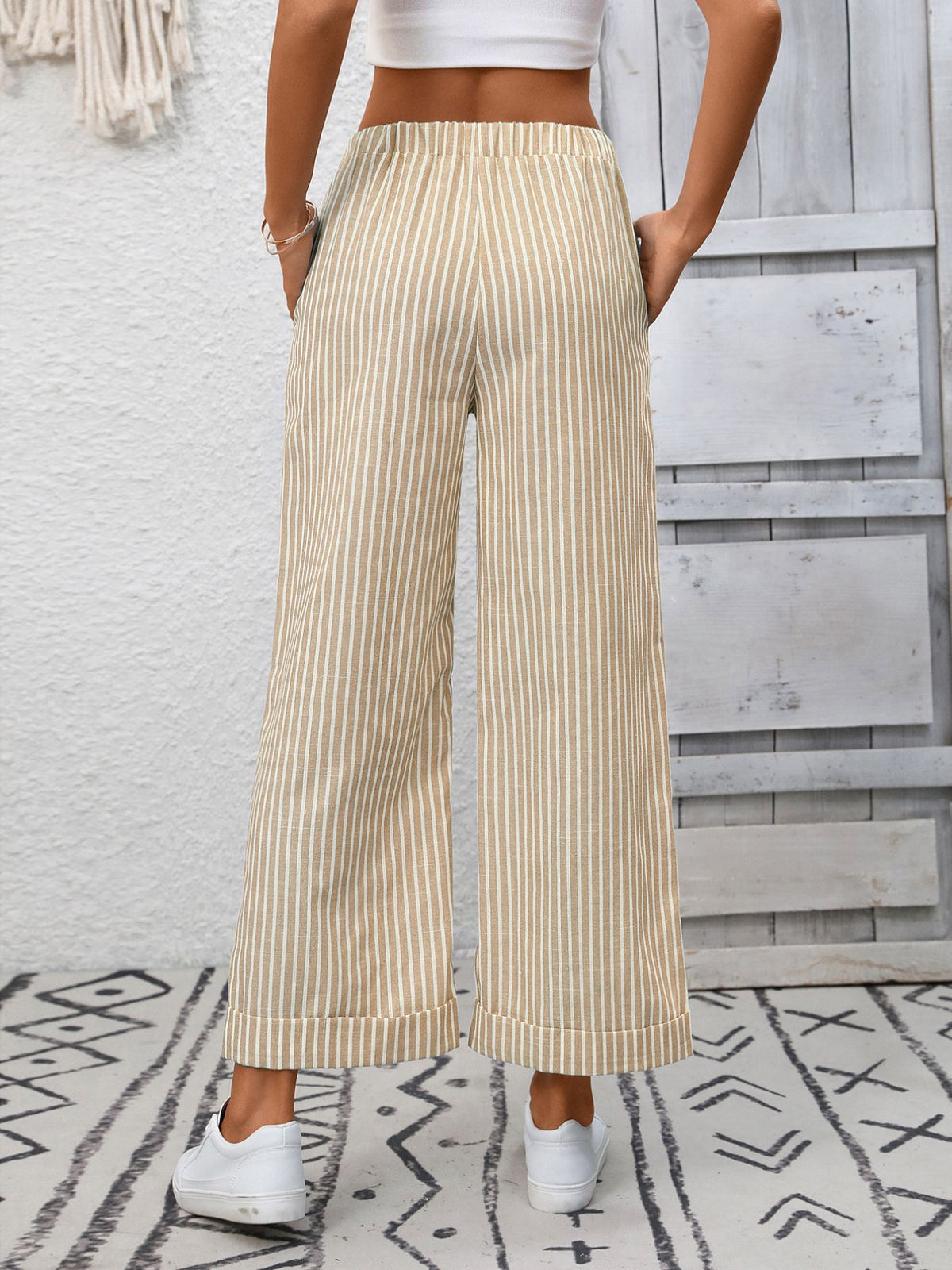 Women’s striped wide-leg drawstring pants with pockets by Plush Fashion Hub, featuring a relaxed fit and comfortable waistband.