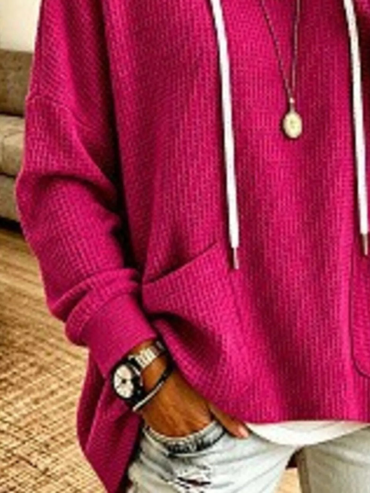 Plus size waffle knit hoodie for women with front pockets, stylish and comfortable, by Trendsi.