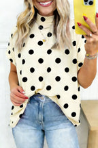 Polka dot print high neck dolman top in black and white, trendy women's blouse with a loose fit and long sleeves.