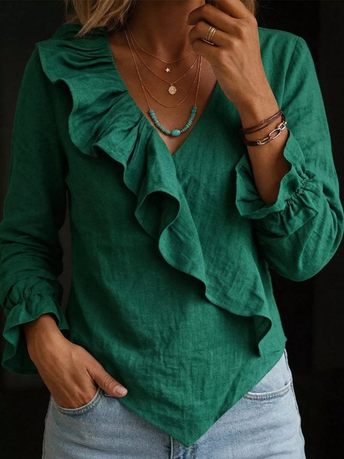 Plus size long sleeve ruffled blouse from Trendsi, featuring feminine ruffle details and full-size fit, styled as a fashionable tops.
