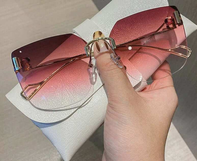 Vintage Brand Designer Sunglasses Fashion Oversized Rimless SunglassesElevate your style with our Vintage Brand Designer Sunglasses. Made with high-quality materials, these oversized rimless sunglasses offer 99% UV protection and 1.3 mSunglassesPlush Fashions ShopPlush Fashion Shop