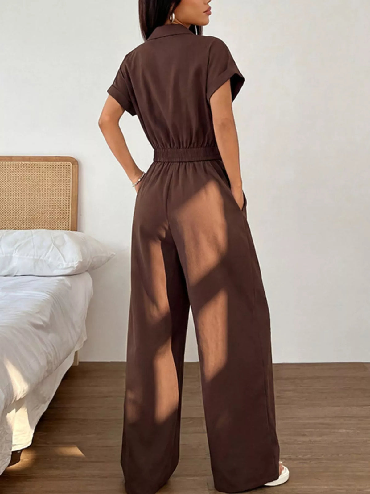 Plush Fashion Hub cargo pocket zipper front jumpsuit with long sleeves and front zipper detail, made of comfortable fabric.
