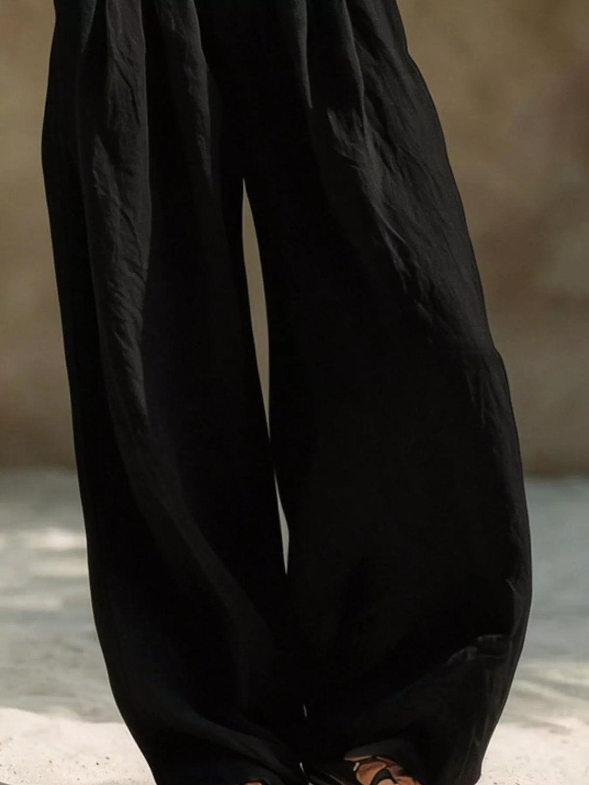 Plus size wide leg pants with full elastic waistband, made by Trendsi, shown in a relaxed fit style.