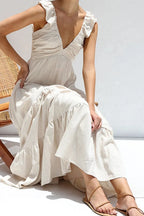 Women's cotton ruffled V-neck tiered midi dress with floral pattern, featuring a flowy silhouette and feminine design.