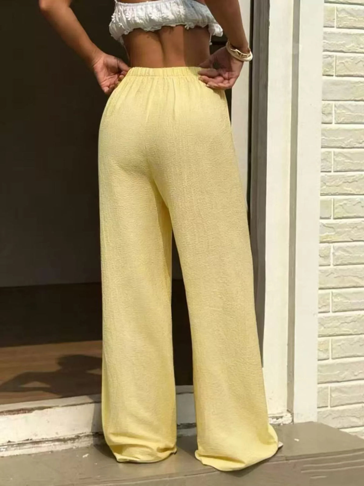 Plus size high-waisted wide-leg pants from Plush Fashion Hub, showcasing a comfortable fit and flowing wide-leg design.