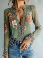Women’s floral print V-neck blouse by FitiqueFit, casualwear with a colorful floral pattern and relaxed fit.