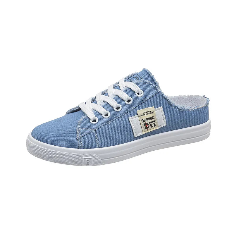 Frayed hem lace-up canvas sneakers in white with distressed details, casual footwear by Trendsi featuring a classic design.