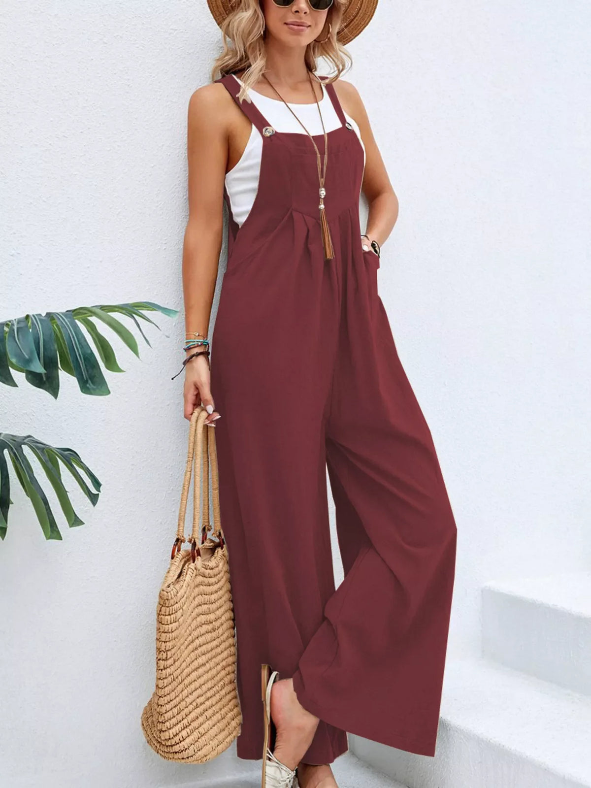Plus size full size casual wide-leg overalls jumpsuit with pockets by Plush Fashion Hub, featuring comfortable relaxed fit and functional pockets.