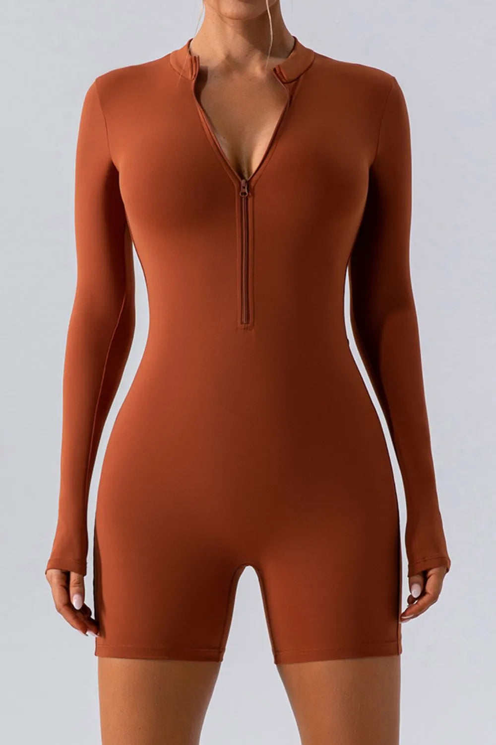 Plush Fashion Hub half zip long sleeve active romper, lightweight athletic wear with a fitted design and zip-up collar.