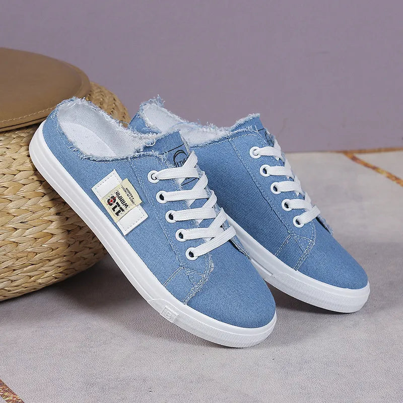 Trendsi frayed hem lace-up canvas sneakers featuring a casual design with distressed edges and white laces.